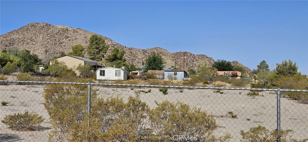 9268 Mesa Road Lucerne Valley, CA 92356 - Photo 2 of 4 a view of a houses with a lake view