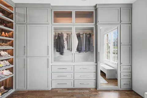 a bedroom with a bed and a table