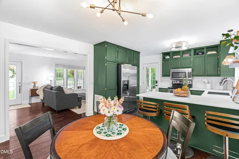 a dining room with furniture and window