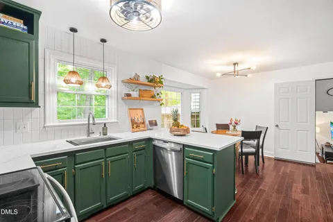 a kitchen with sink and window