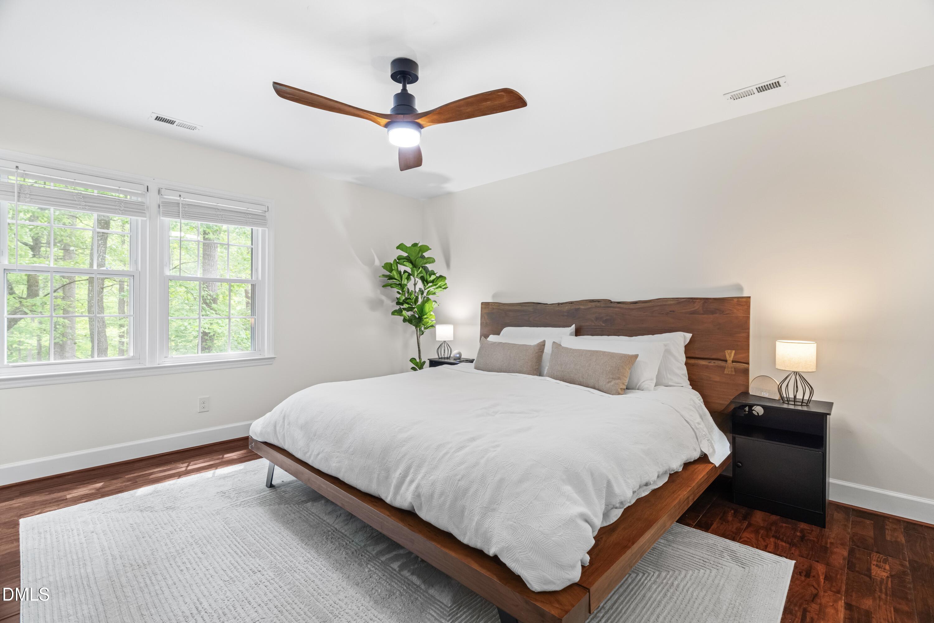 1109 Theresa Court Raleigh, NC 27615 - Photo 15 of 39 a bedroom with a bed and a window