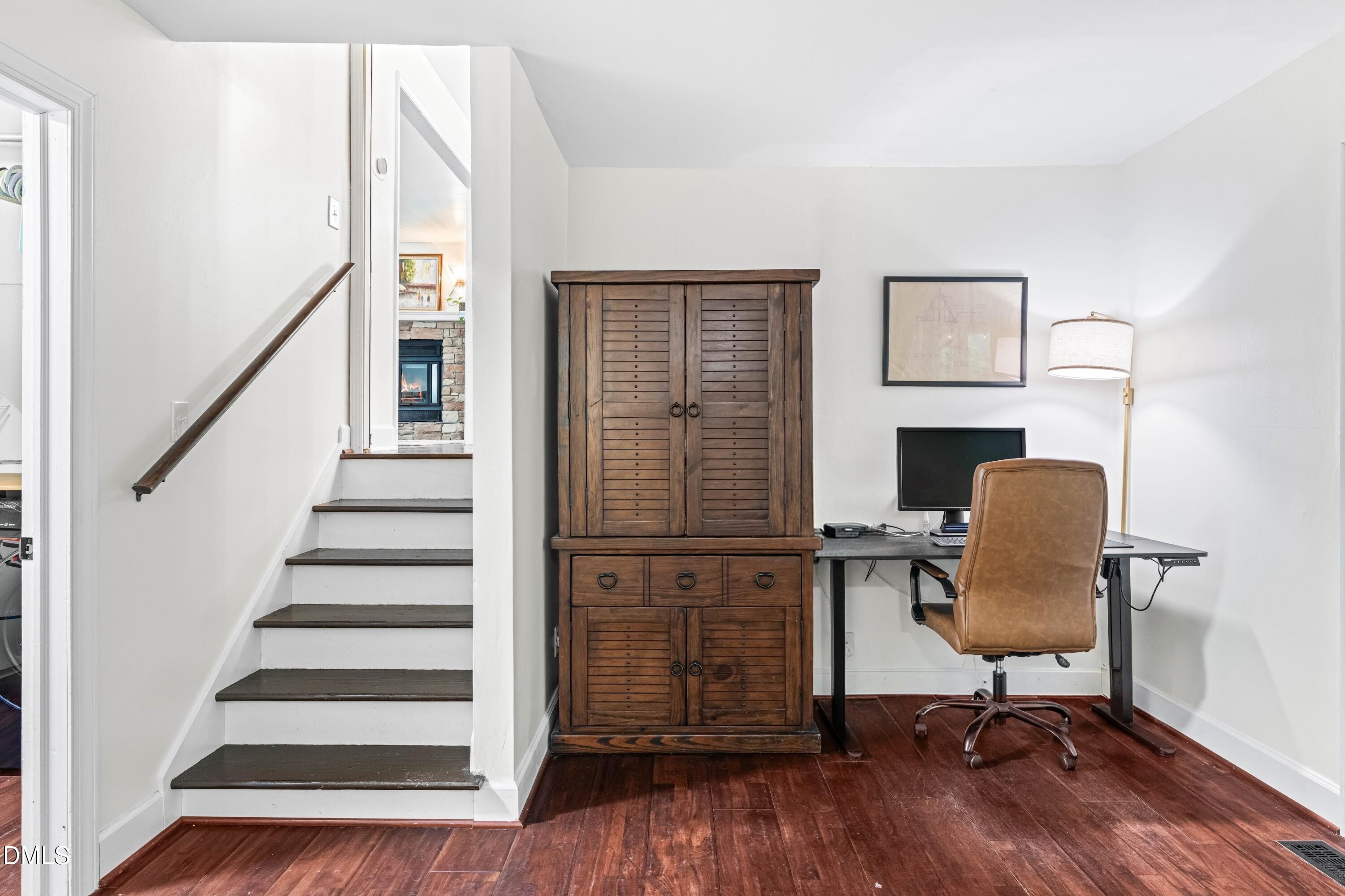 1109 Theresa Court Raleigh, NC 27615 - Photo 24 of 39 a view of a workspace with wooden floor lounge chair and windows