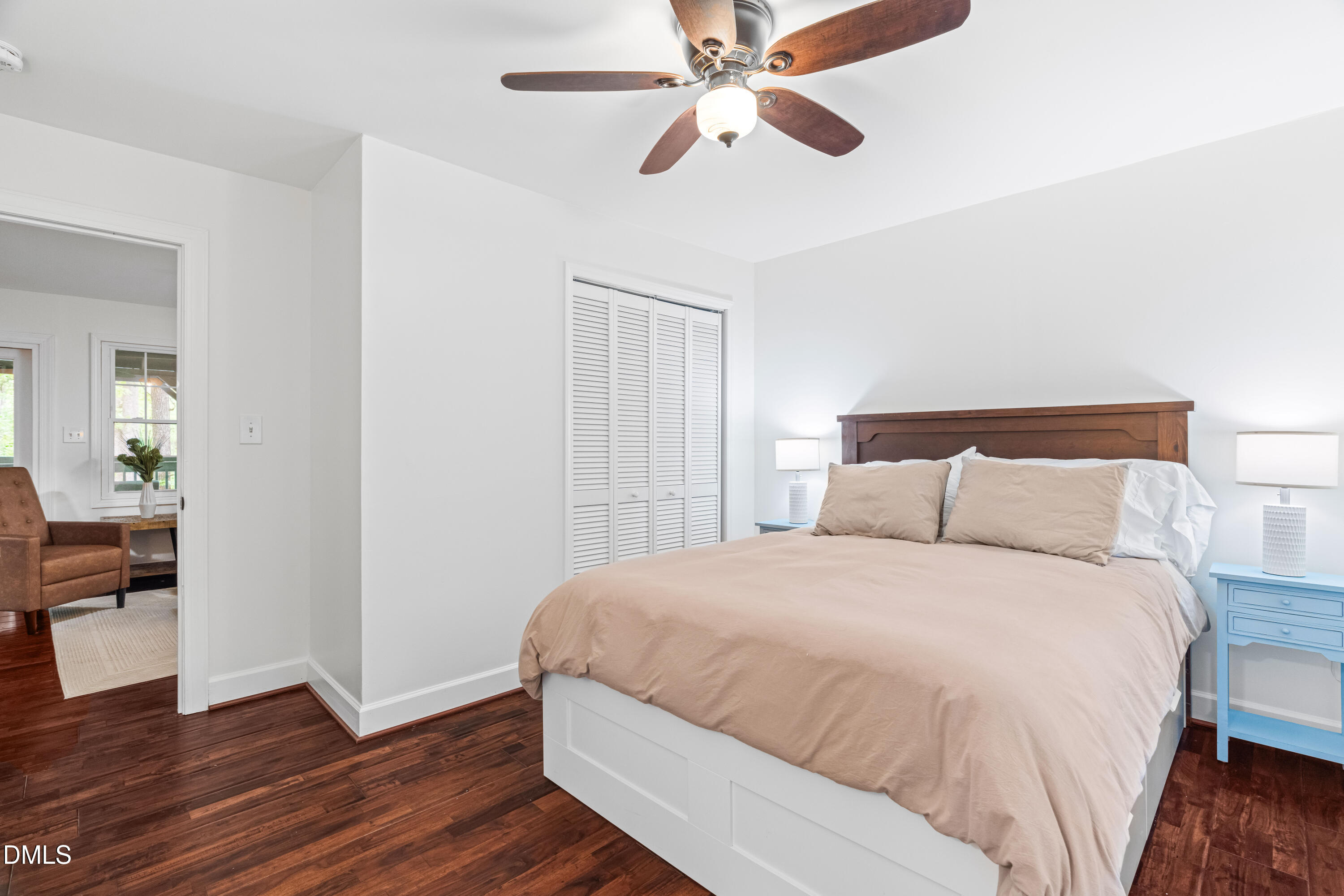 1109 Theresa Court Raleigh, NC 27615 - Photo 26 of 39 a bedroom with a bed and wooden floor