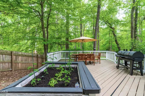 a view of balcony with wooden floor and outdoor seating