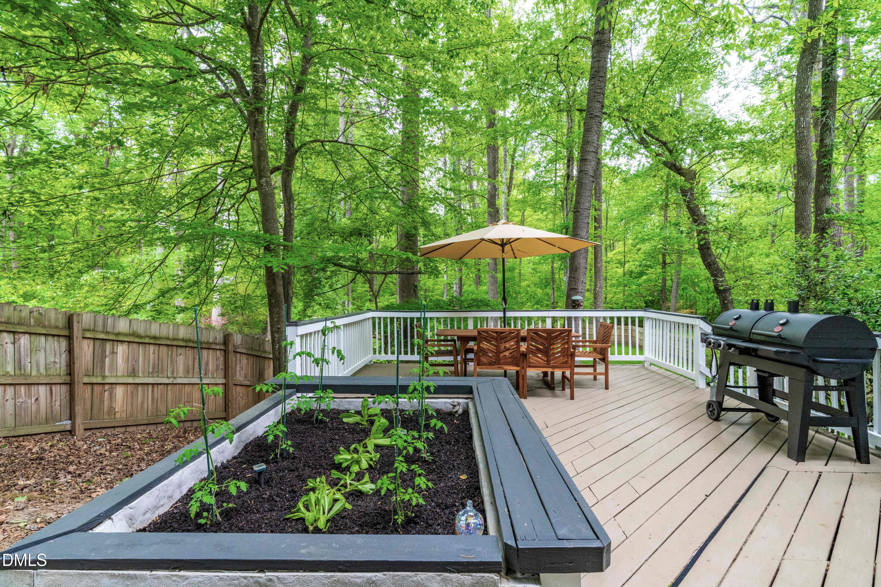 1109 Theresa Court Raleigh, NC 27615 - Photo 32 of 39 a view of balcony with wooden floor and outdoor seating