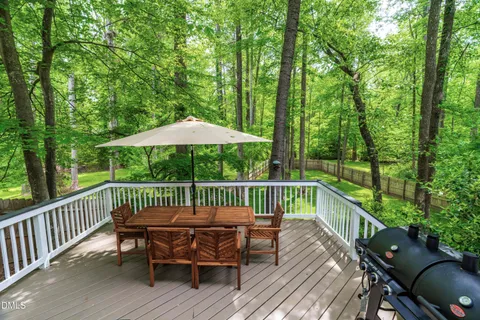 a view of a wooden deck with furniture