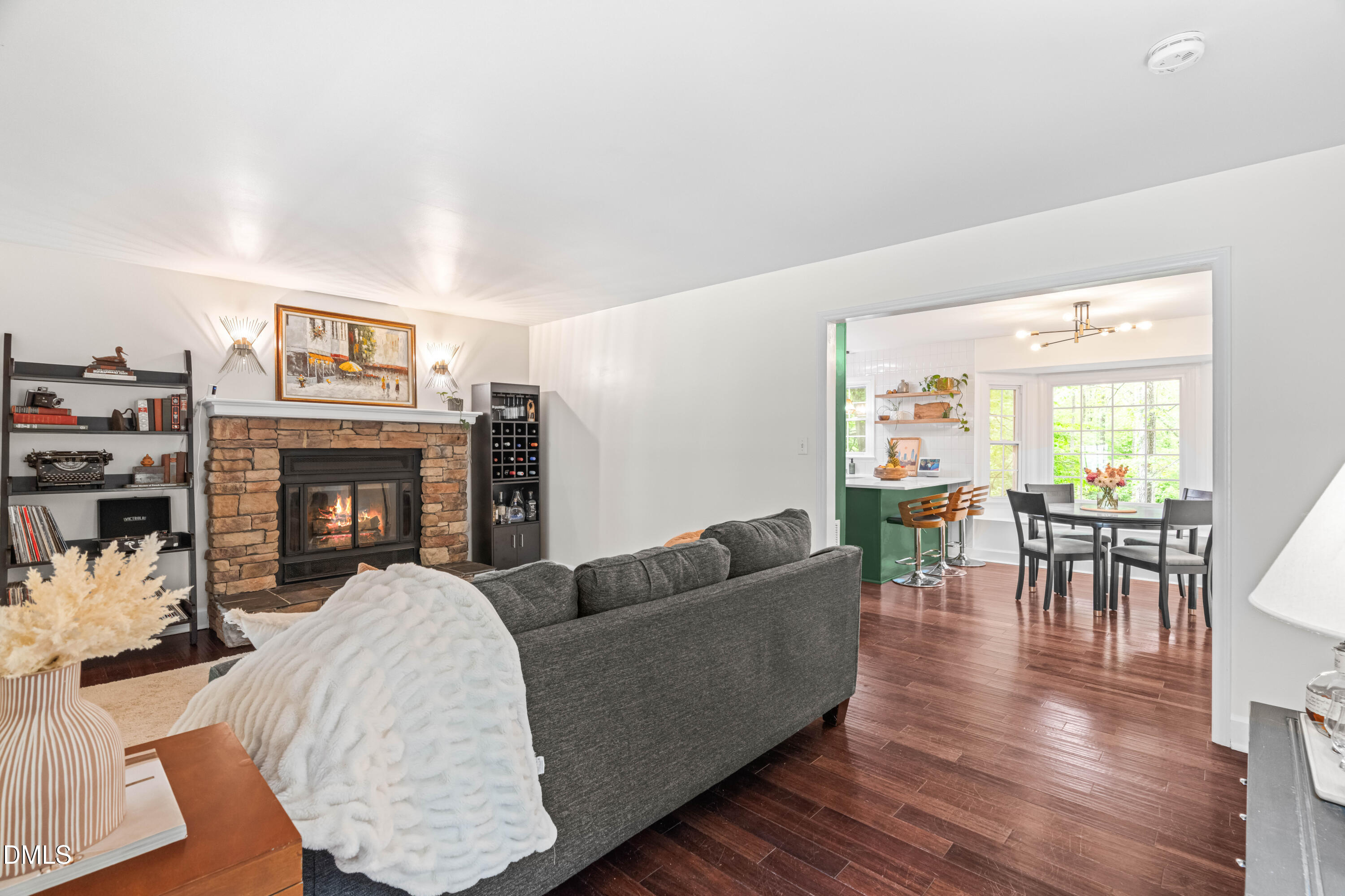 1109 Theresa Court Raleigh, NC 27615 - Photo 5 of 39 a living room with furniture a fireplace and a large window