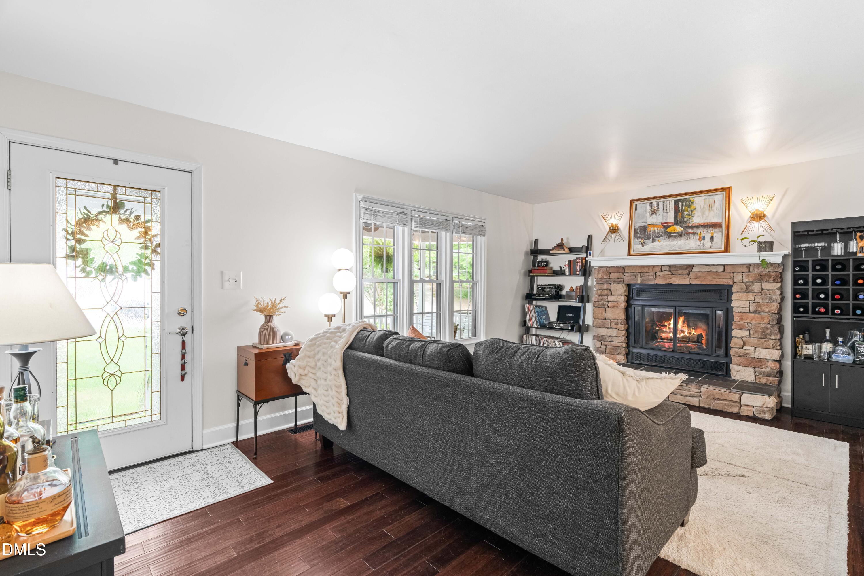 1109 Theresa Court Raleigh, NC 27615 - Photo 6 of 39 a living room with furniture and a fireplace