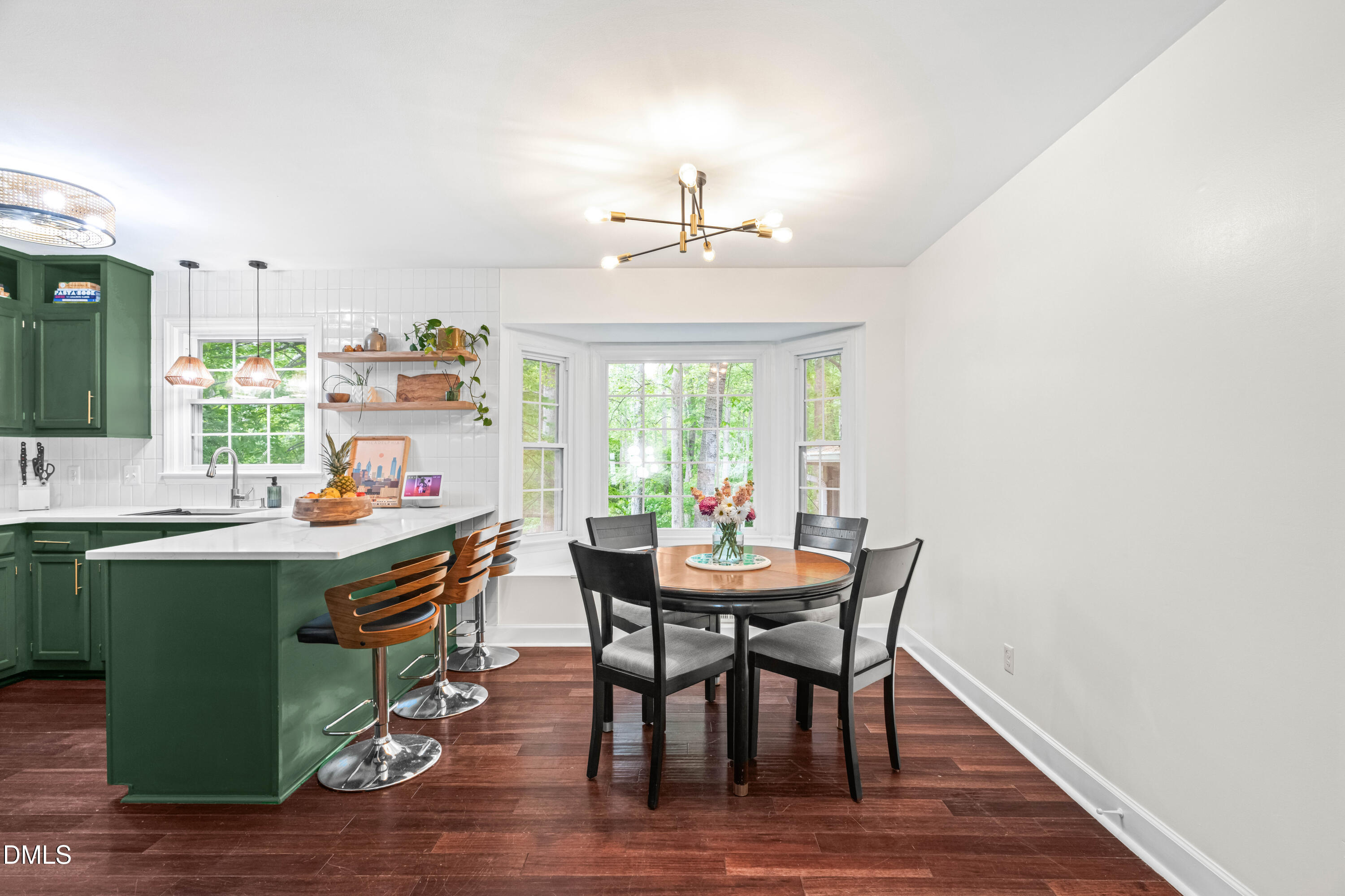 1109 Theresa Court Raleigh, NC 27615 - Photo 8 of 39 a view of a dining room with furniture window and wooden floor