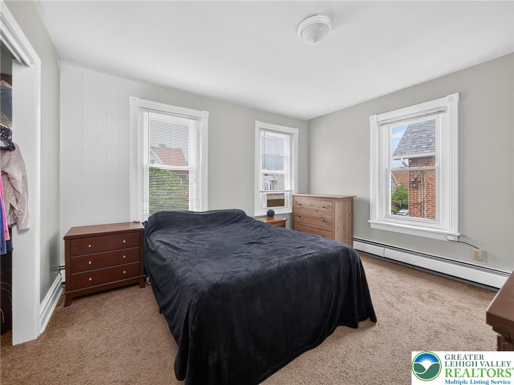 425 Ridge Street Emmaus, PA 18049 - Photo 18 of 27 An inviting sleeping space with warm carpet and ample window light, perfect for peaceful rest.
