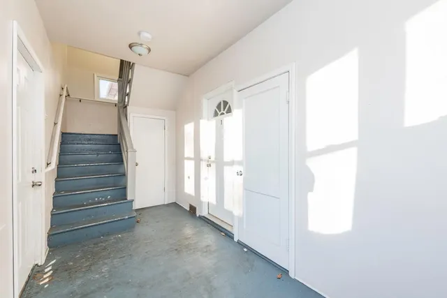 a view of entryway with stairs