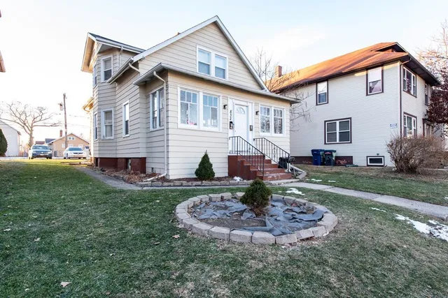 a front view of a house with a yard