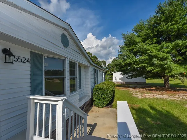 a kitchen with a sink wooden floor and kitchen island