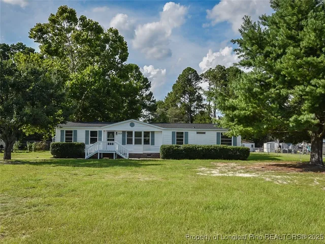 a kitchen with stainless steel appliances a stove a microwave and cabinets