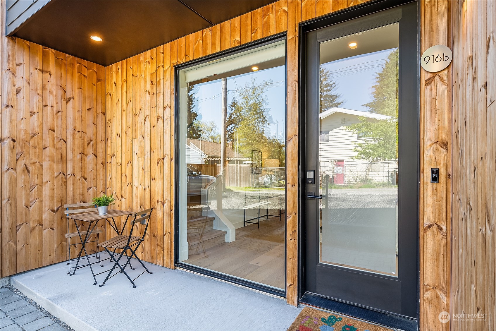 916 North 100th Street, Unit B Seattle, WA 98133 - Photo 2 of 19 a very nice looking room with a large window and glass door
