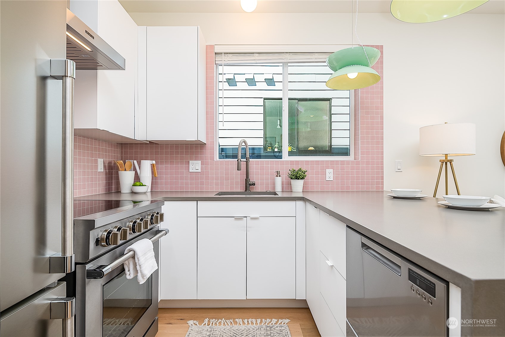 916 North 100th Street, Unit B Seattle, WA 98133 - Photo 6 of 19 a kitchen with a sink and a stove