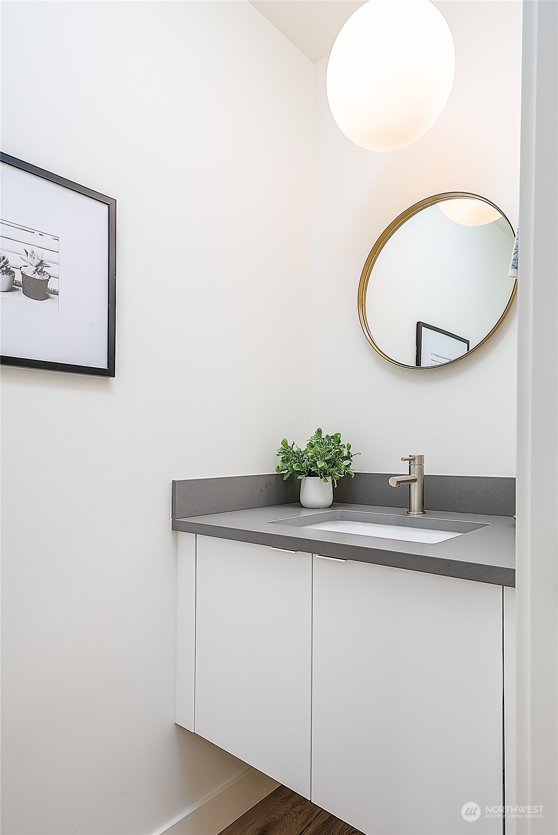 916 North 100th Street, Unit B Seattle, WA 98133 - Photo 9 of 19 a bathroom with a sink and a mirror
