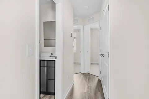 a view of bathroom with a shower and a sink