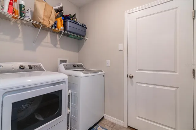 a utility room with dryer and washer