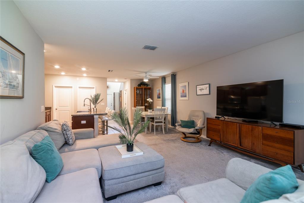 5127 Sable Chime Drive Wimauma, FL 33598 - Photo 17 of 56 a living room with furniture and a flat screen tv