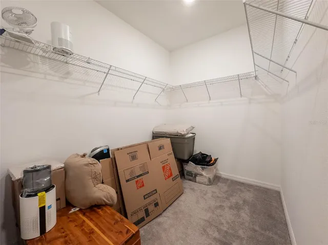 a bedroom with a bed and cabinets