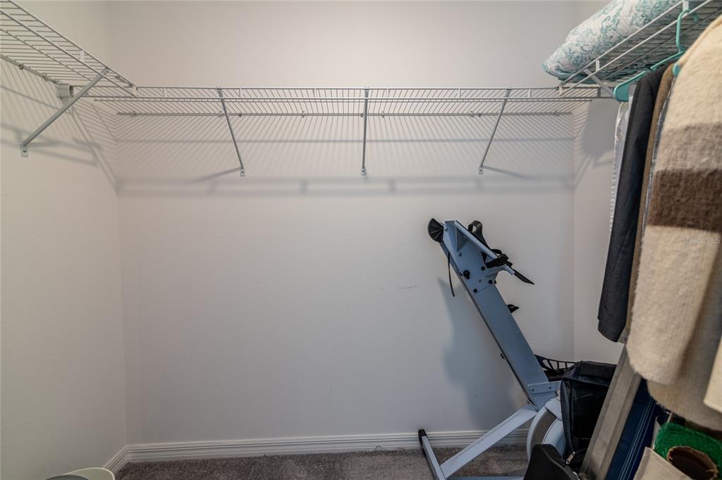 5127 Sable Chime Drive Wimauma, FL 33598 - Photo 31 of 56 a view of a room with racks on the wall