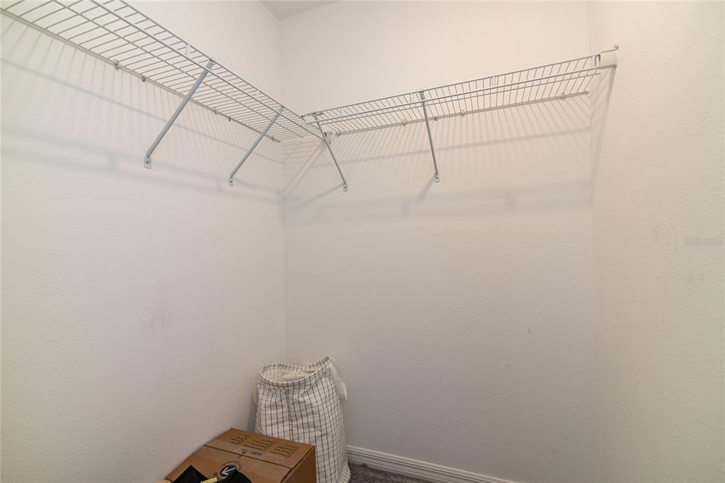 5127 Sable Chime Drive Wimauma, FL 33598 - Photo 36 of 56 a view of small space with empty racks