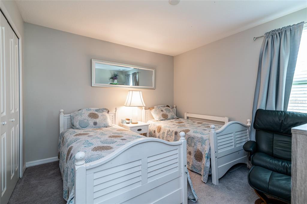 5127 Sable Chime Drive Wimauma, FL 33598 - Photo 37 of 56 a bedroom with a bed and a window