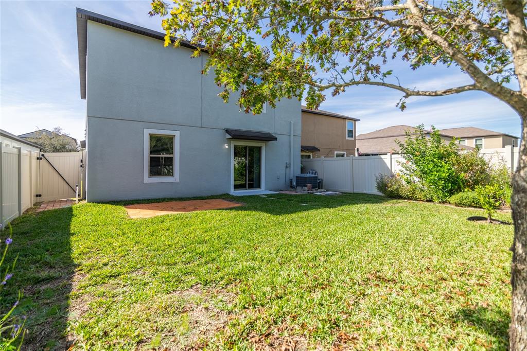 5127 Sable Chime Drive Wimauma, FL 33598 - Photo 40 of 56 a view of a house with a yard