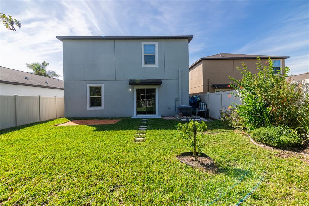 5127 Sable Chime Drive Wimauma, FL 33598 - Photo 41 of 56 a house view with a garden space