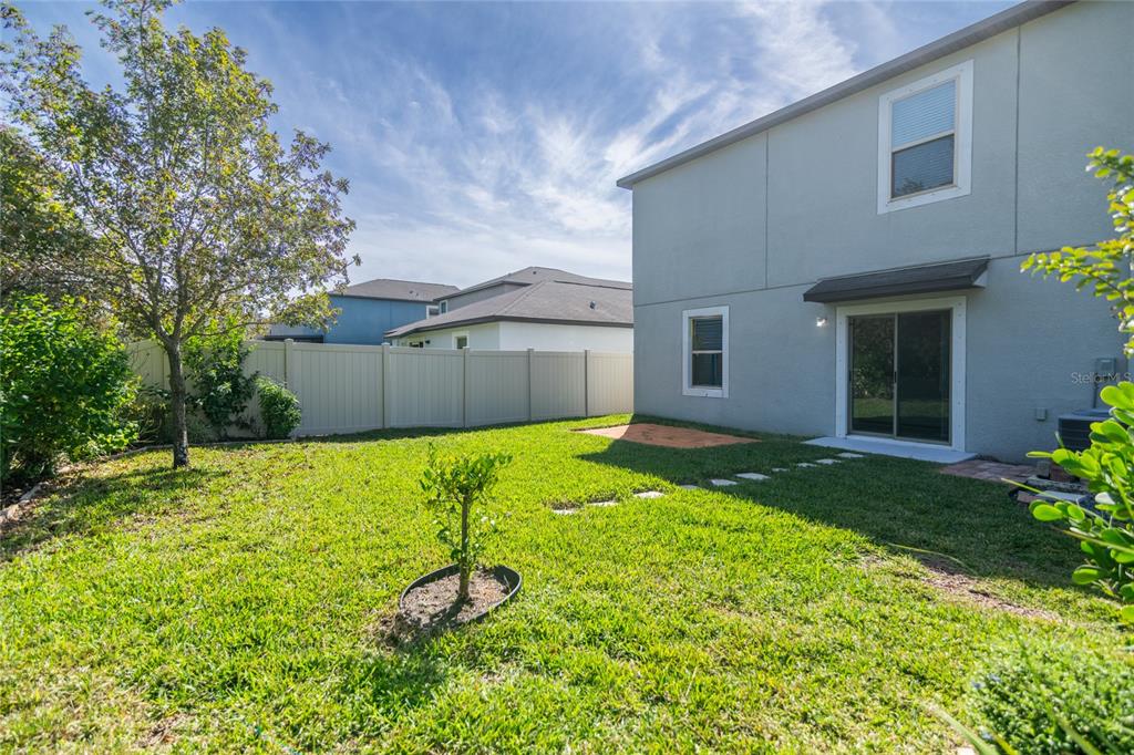 5127 Sable Chime Drive Wimauma, FL 33598 - Photo 42 of 56 a house with a yard