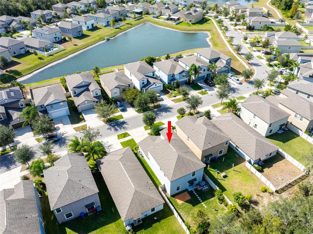 5127 Sable Chime Drive Wimauma, FL 33598 - Photo 47 of 56 an aerial view of a house with a swimming pool and outdoor seating