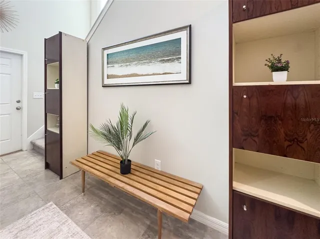 a view of room with window and wooden floor