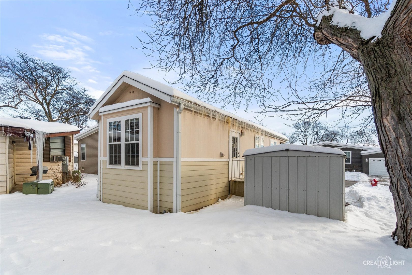 192 Parkwood Road Elgin, IL 60123 - Photo 12 of 14 a view of a house with a yard and garage