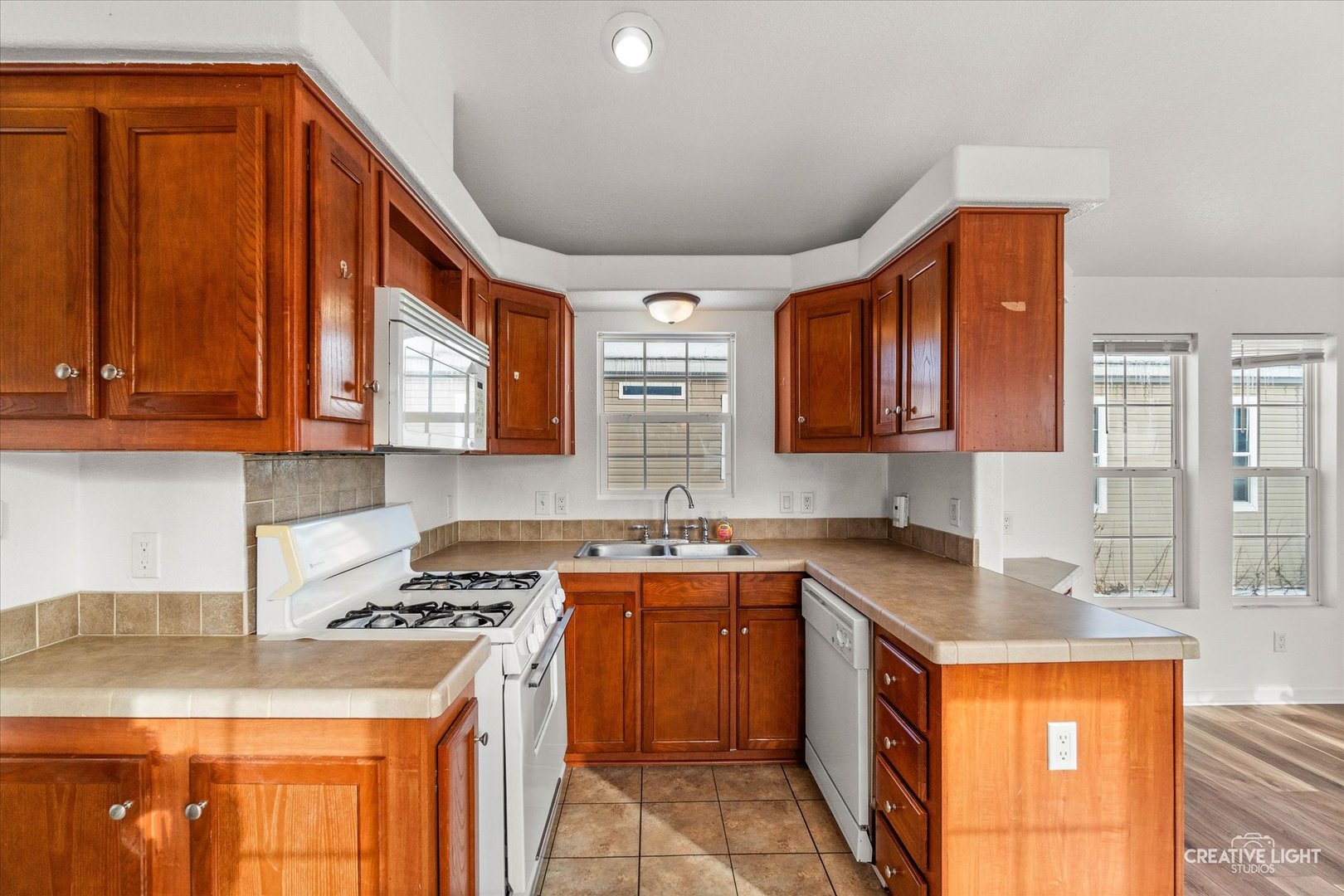 192 Parkwood Road Elgin, IL 60123 - Photo 5 of 14 a kitchen with stainless steel appliances granite countertop a sink stove and refrigerator