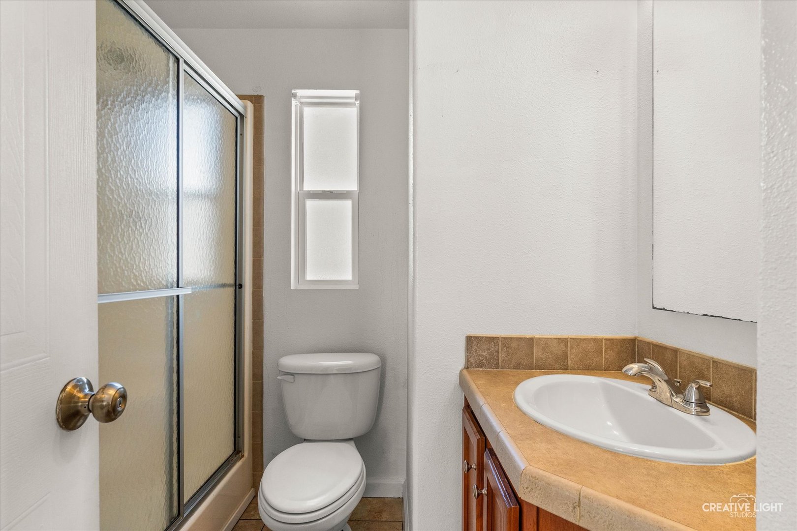 192 Parkwood Road Elgin, IL 60123 - Photo 7 of 14 a bathroom with a sink toilet and shower