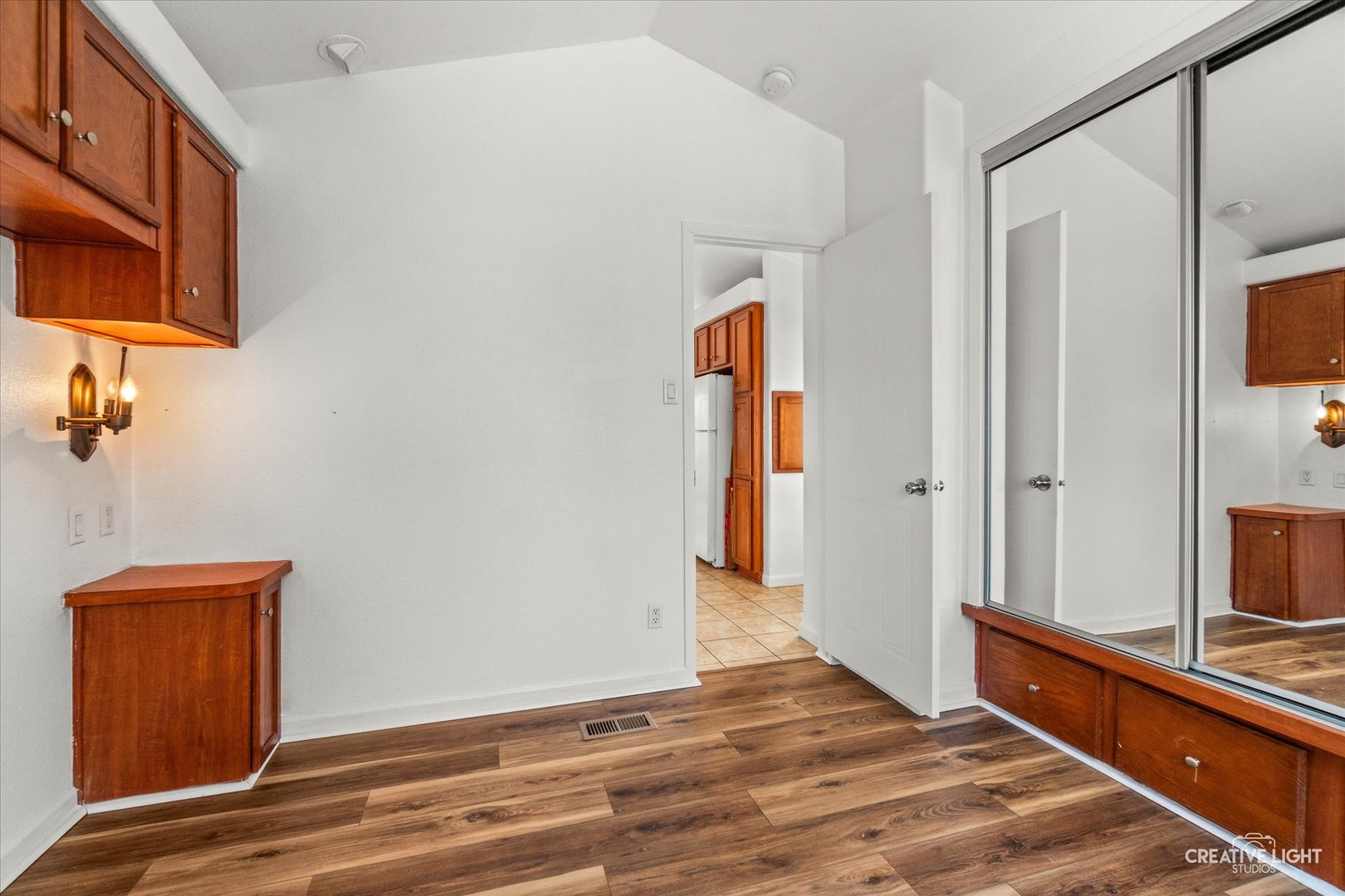 192 Parkwood Road Elgin, IL 60123 - Photo 9 of 14 a view of a hallway with wooden floor and a cabinet