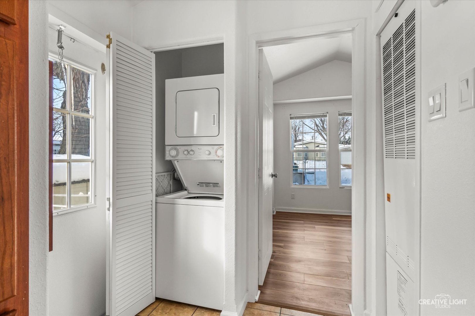 192 Parkwood Road Elgin, IL 60123 - Photo 10 of 14 a view of a hallway with wooden floor and a living room