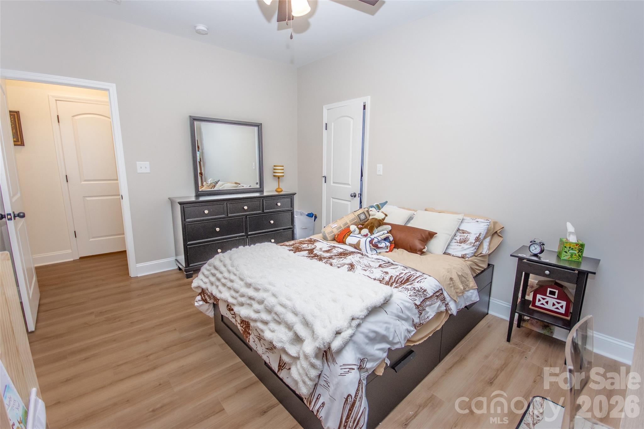 540 New Salem Road, Unit 1011 Statesville, NC 28625 - Photo 14 of 36 a bedroom with a bed and wooden floor