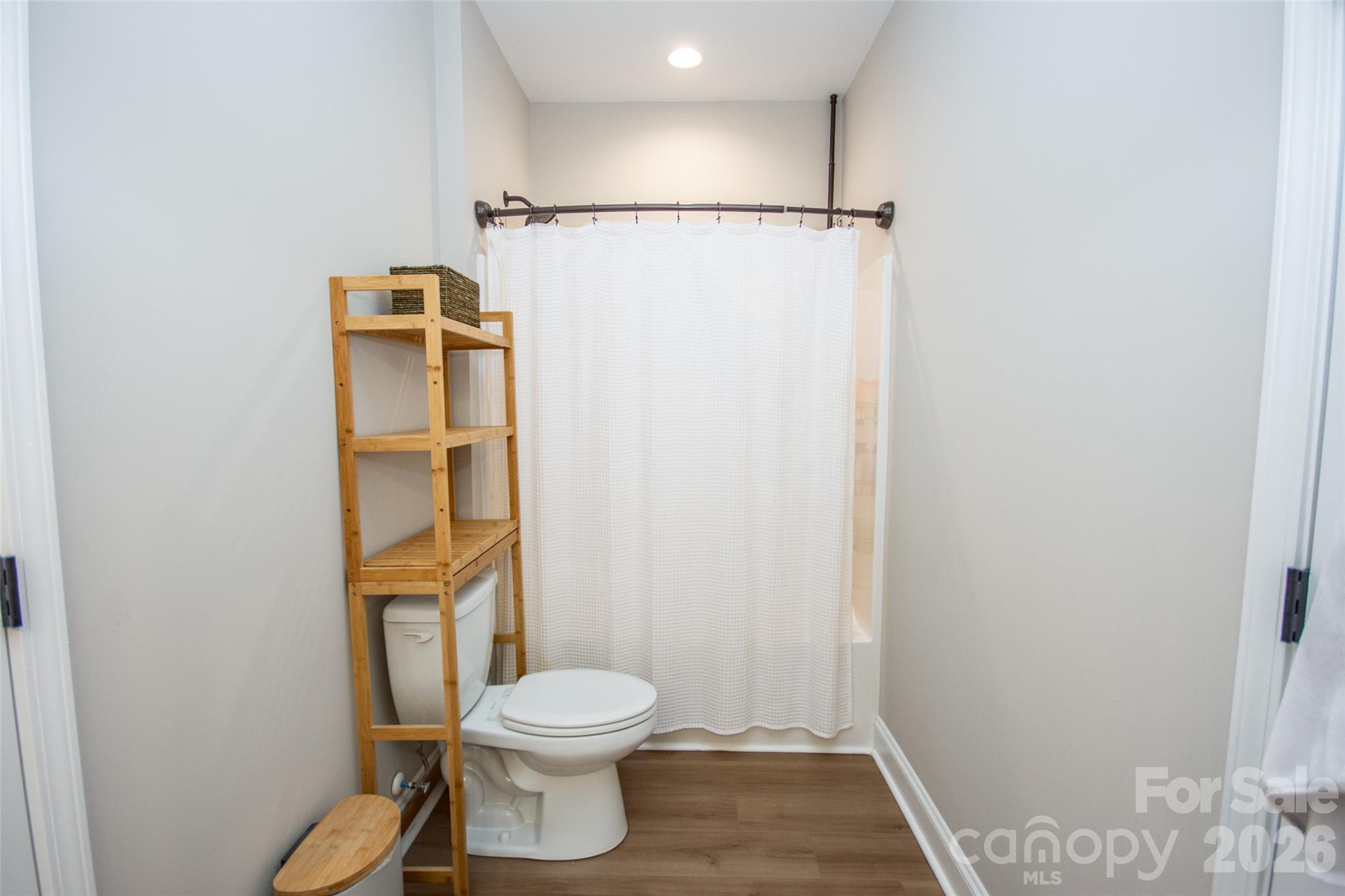 540 New Salem Road, Unit 1011 Statesville, NC 28625 - Photo 16 of 36 a white toilet sitting next to a shower