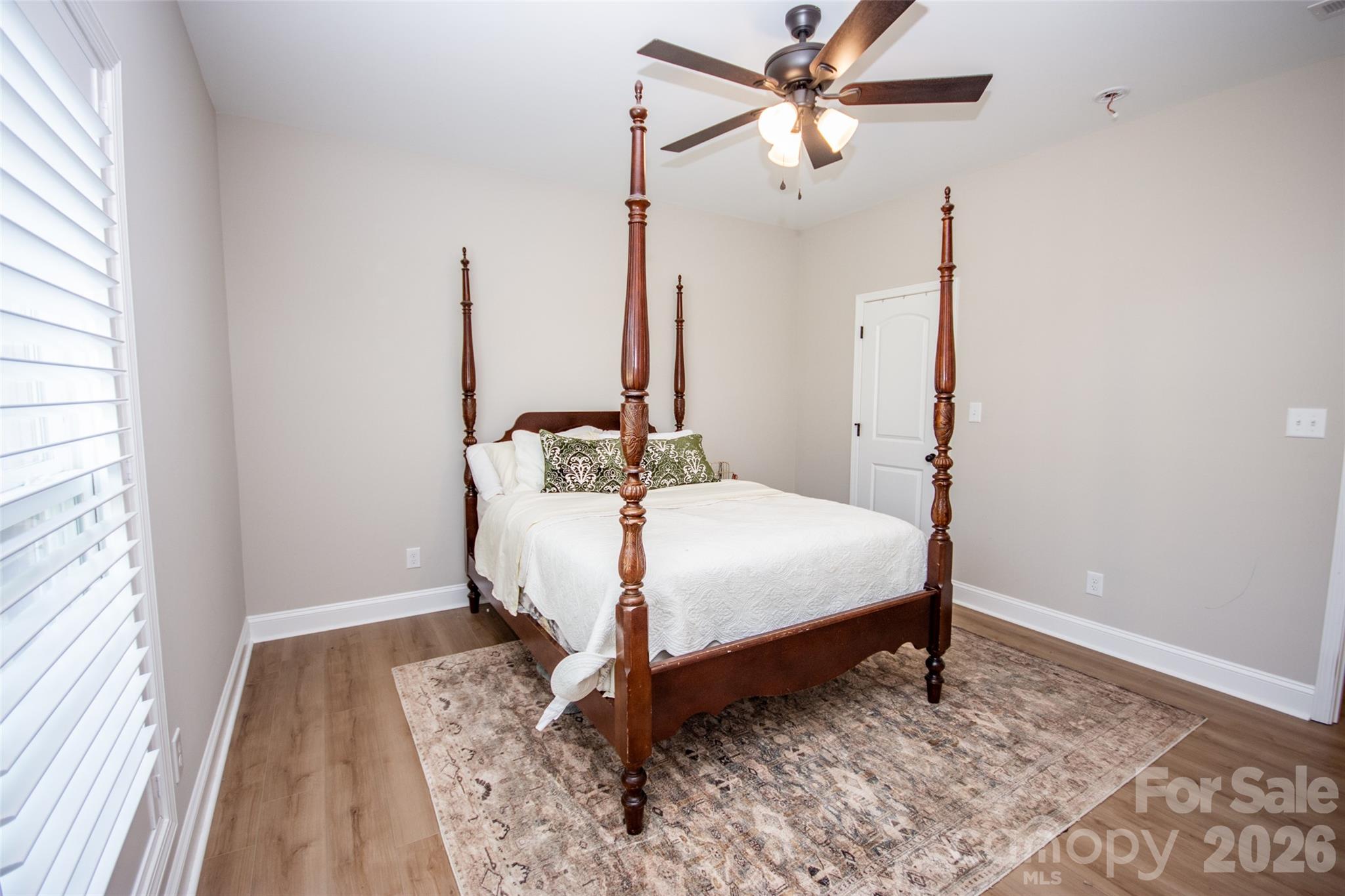540 New Salem Road, Unit 1011 Statesville, NC 28625 - Photo 18 of 36 a bedroom with a bed and a window