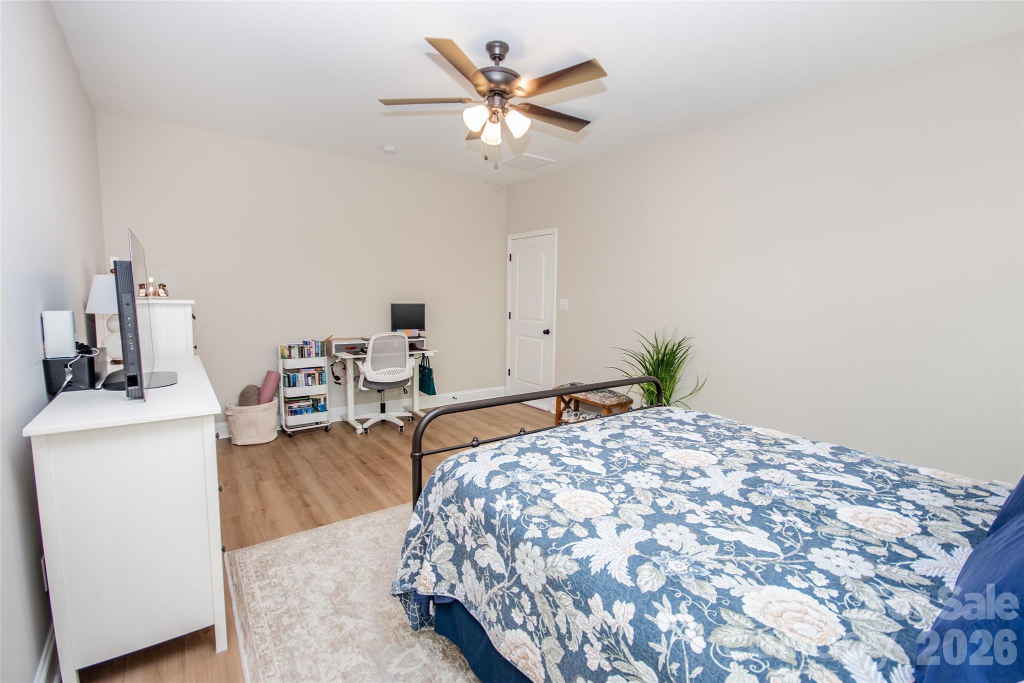 540 New Salem Road, Unit 1011 Statesville, NC 28625 - Photo 20 of 36 a bedroom with a bed and a chandelier