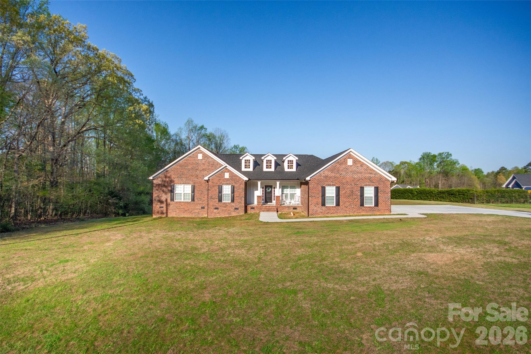 540 New Salem Road, Unit 1011 Statesville, NC 28625 - Photo 2 of 36 a big house with a big yard and large trees