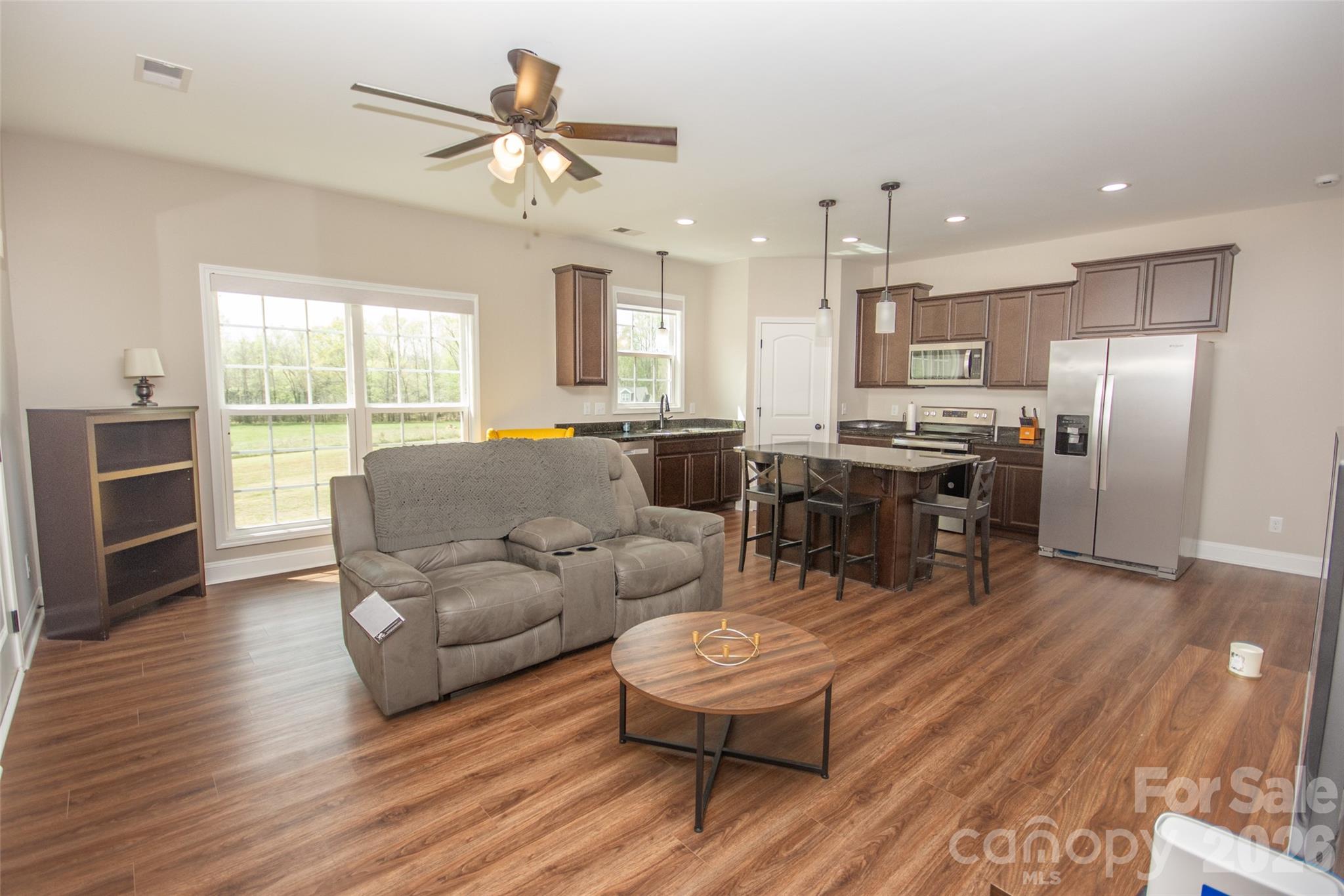540 New Salem Road, Unit 1011 Statesville, NC 28625 - Photo 25 of 36 a living room with furniture kitchen view and a large window