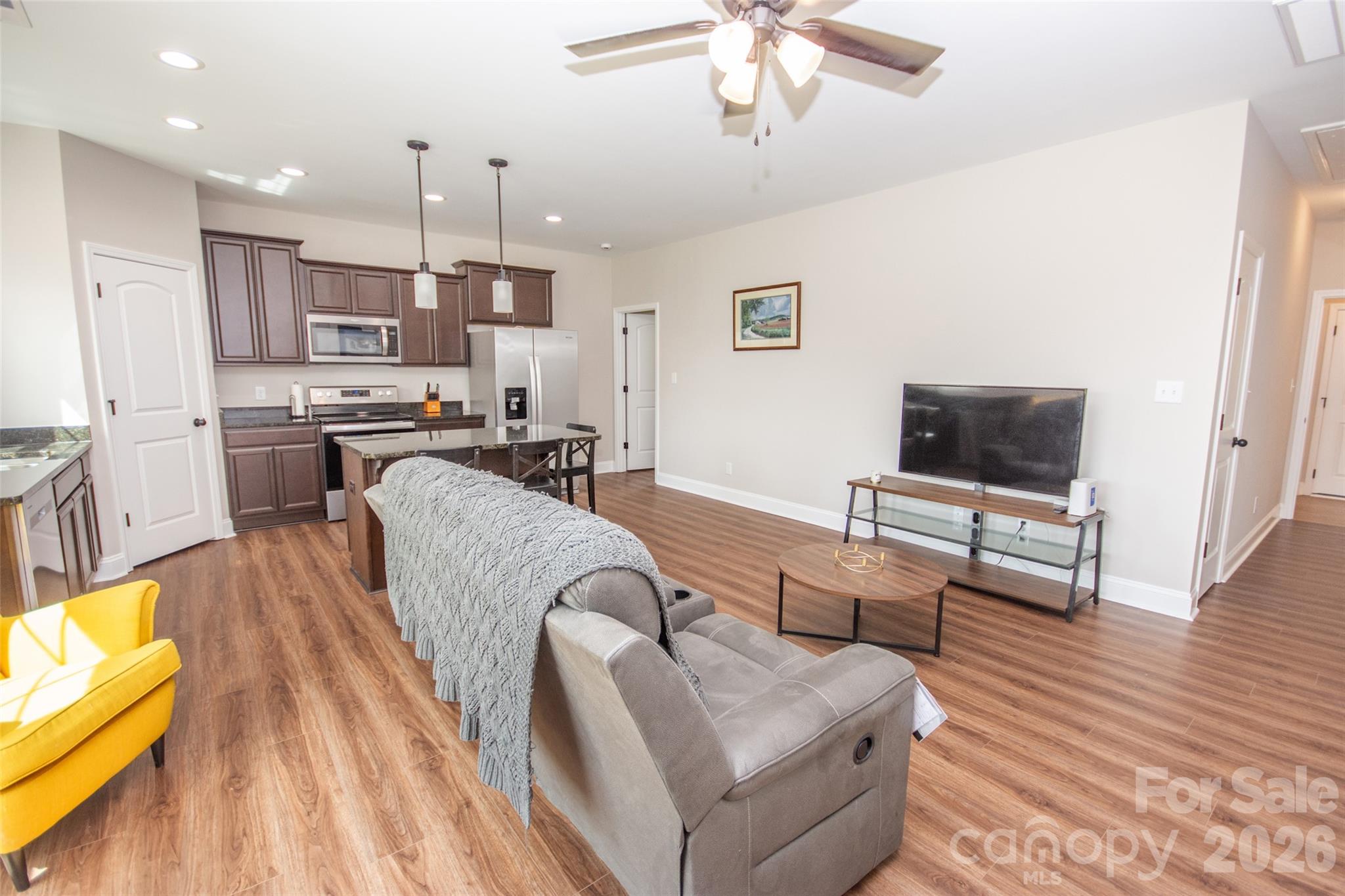 540 New Salem Road, Unit 1011 Statesville, NC 28625 - Photo 26 of 36 a living room with furniture and a flat screen tv
