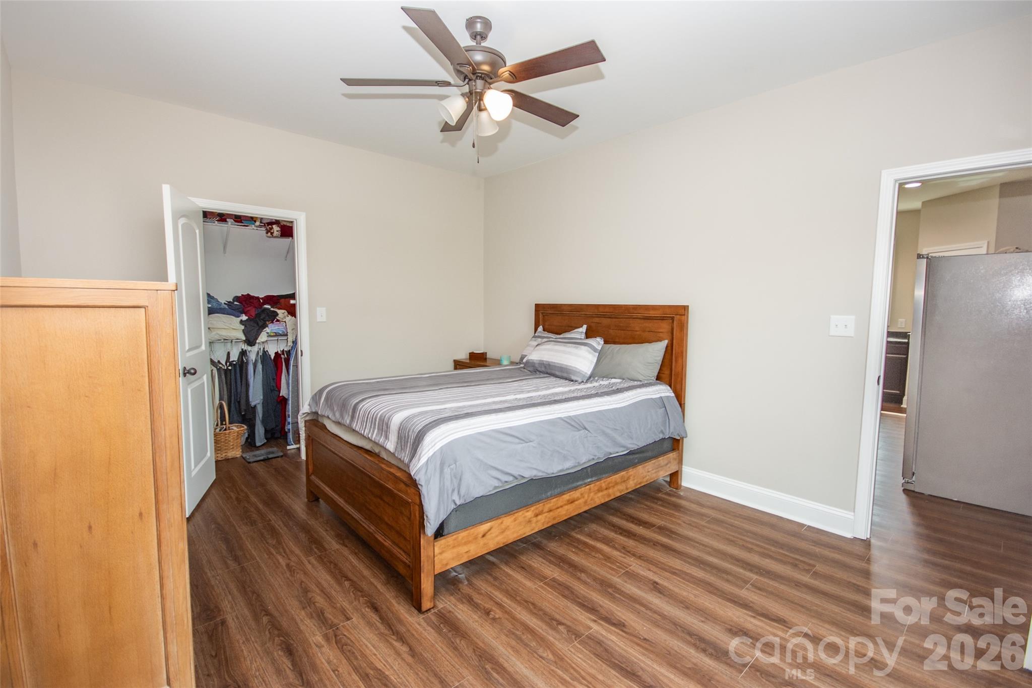 540 New Salem Road, Unit 1011 Statesville, NC 28625 - Photo 28 of 36 a bedroom with a bed and wooden floor