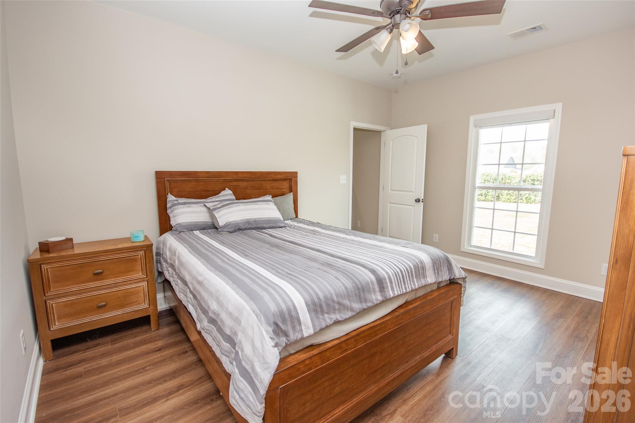 540 New Salem Road, Unit 1011 Statesville, NC 28625 - Photo 29 of 36 a bedroom with a bed and window