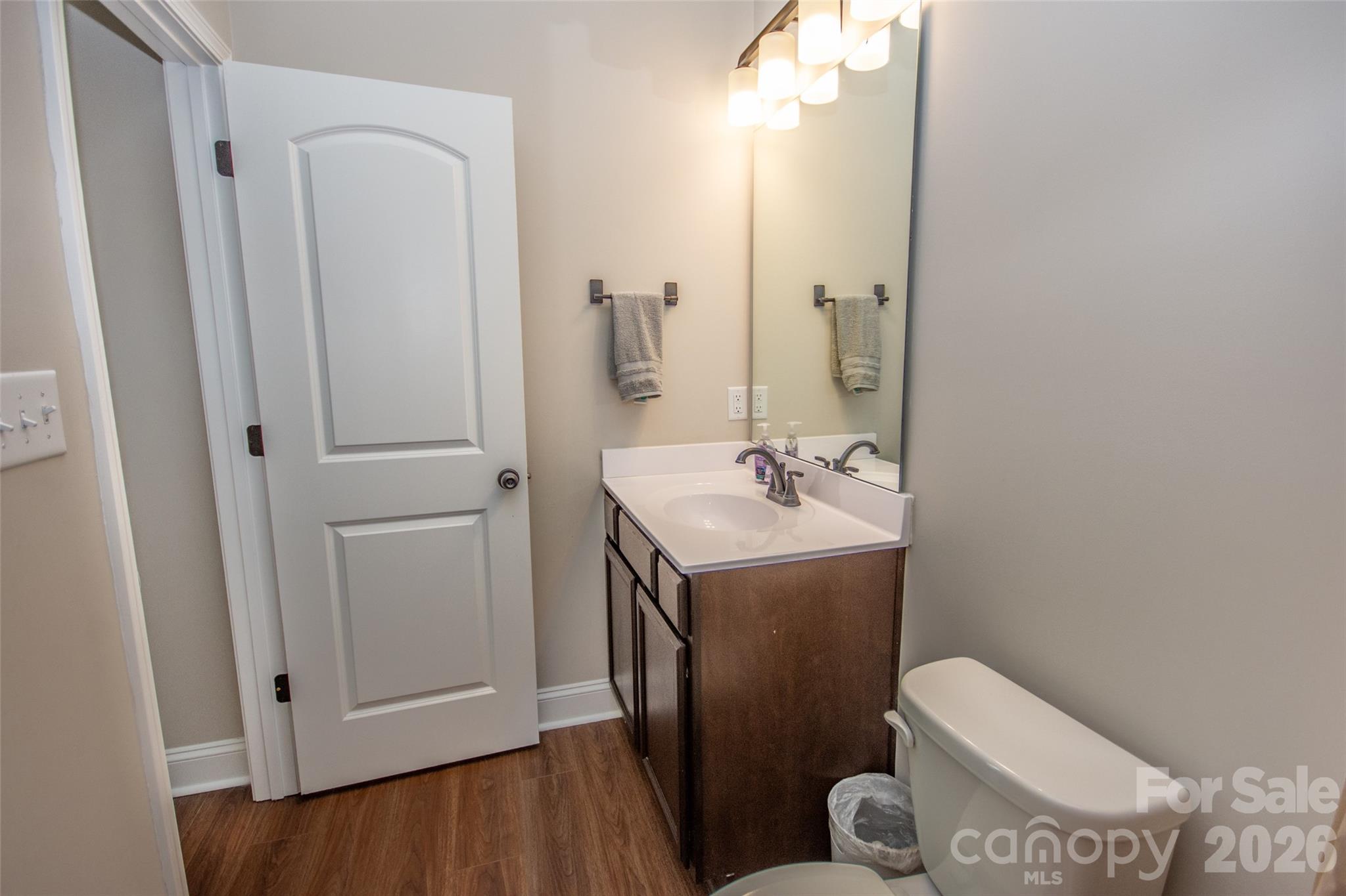540 New Salem Road, Unit 1011 Statesville, NC 28625 - Photo 30 of 36 a bathroom with a sink toilet and vanity