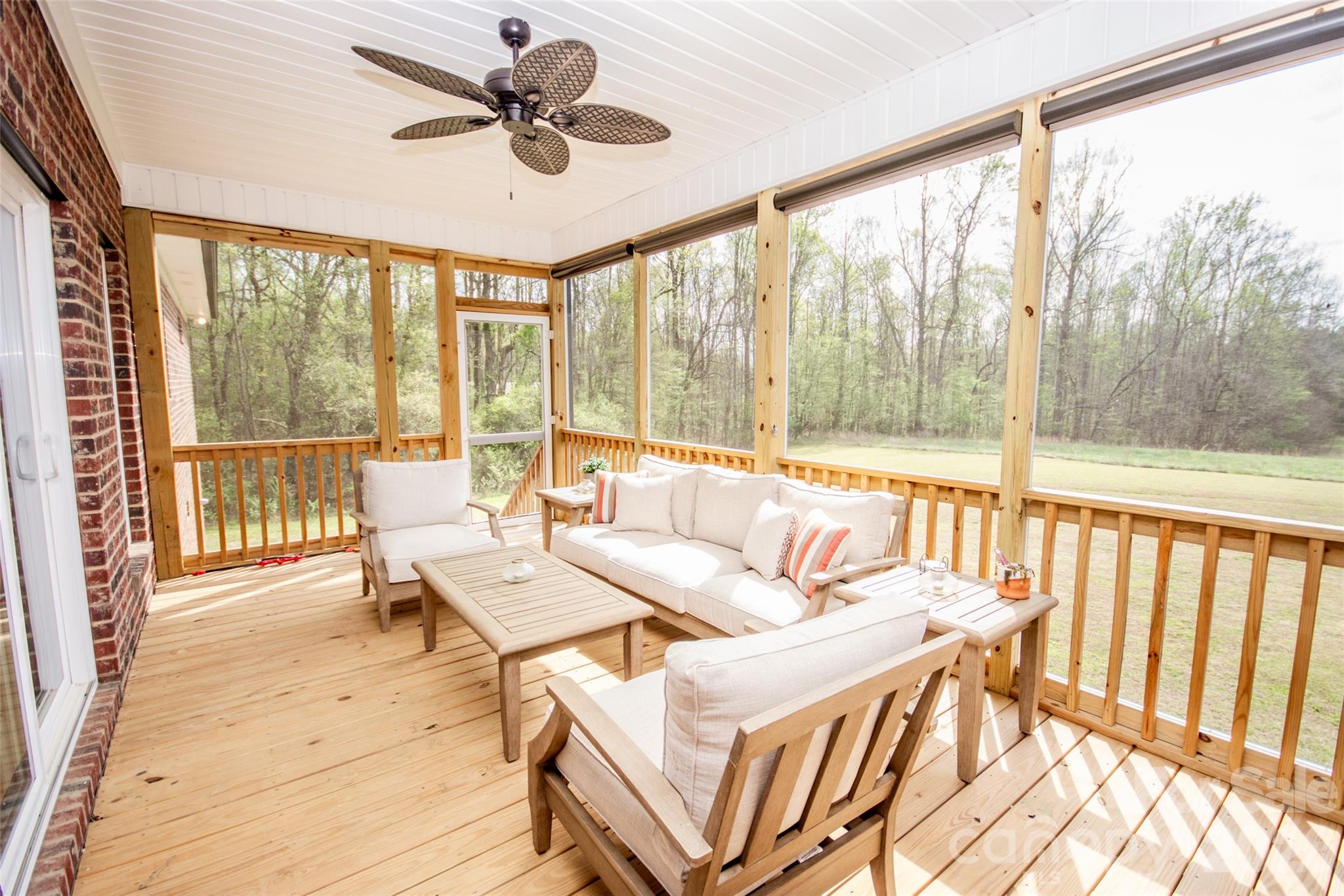 540 New Salem Road, Unit 1011 Statesville, NC 28625 - Photo 31 of 36 a living room with furniture and a large window with wooden floor