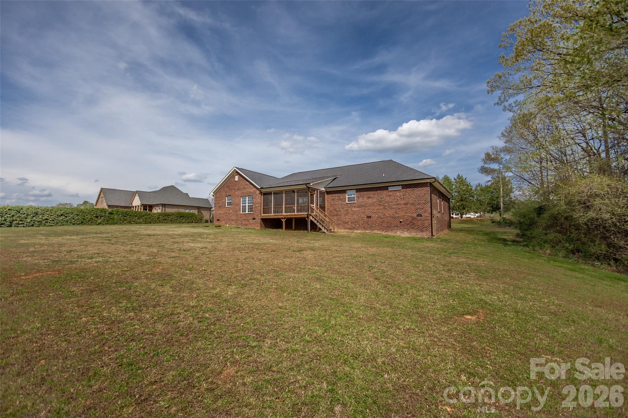 540 New Salem Road, Unit 1011 Statesville, NC 28625 - Photo 32 of 36 a front view of a house with a garden and lake view